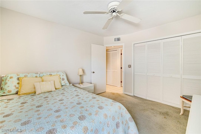 9648 Windsor Gardens Ln Unit 104, Fort Myers, FL 33919 - bedroom with carpet, a ceiling fan, and a closet