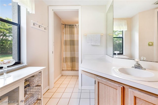9648 Windsor Gardens Ln Unit 104, Fort Myers, FL 33919 - bathroom featuring vanity, tile patterned floors, and a shower with shower curtain
