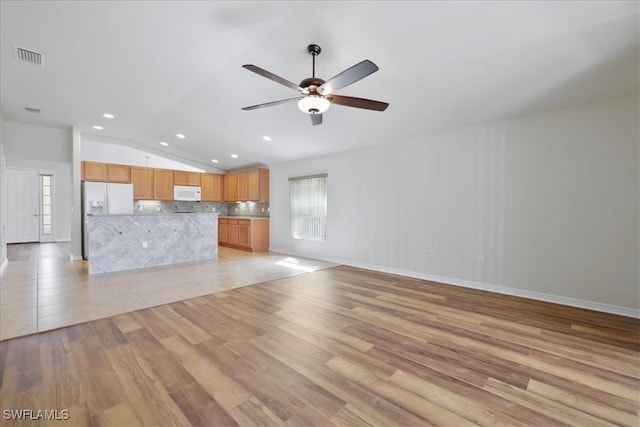 2457 Sutherland Ct, Cape Coral, FL 33991 - unfurnished living room featuring vaulted ceiling, plenty of natural light, light wood-style flooring, a ceiling fan, and recessed lighting