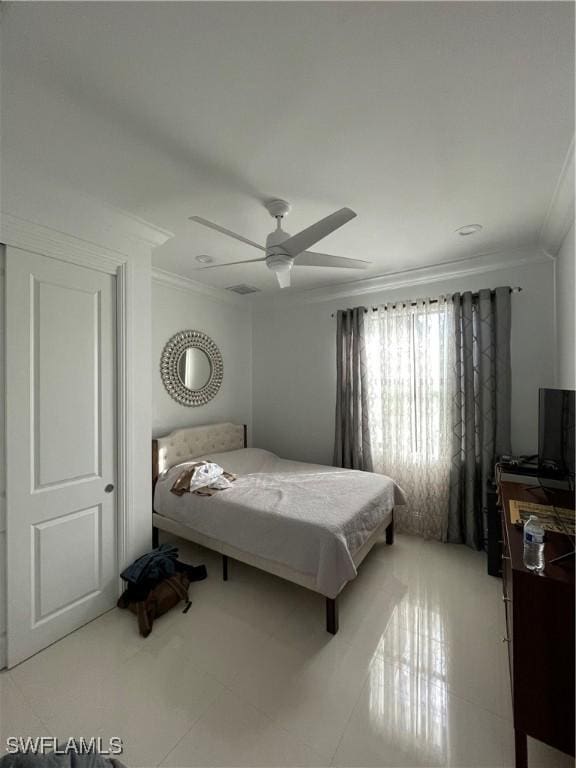 3393 21st Ave SW, Naples, FL 34117 - bedroom featuring ornamental molding, ceiling fan, and light tile patterned floors