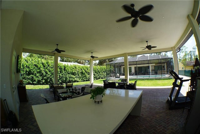3393 21st Ave SW, Naples, FL 34117 - view of patio with outdoor dining area, a ceiling fan, and an outdoor pool
