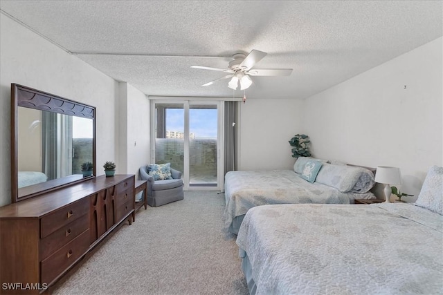 7148 Estero Blvd Unit 423, Fort Myers Beach, FL 33931 - bedroom with a textured ceiling, a ceiling fan, carpet floors, and access to outside