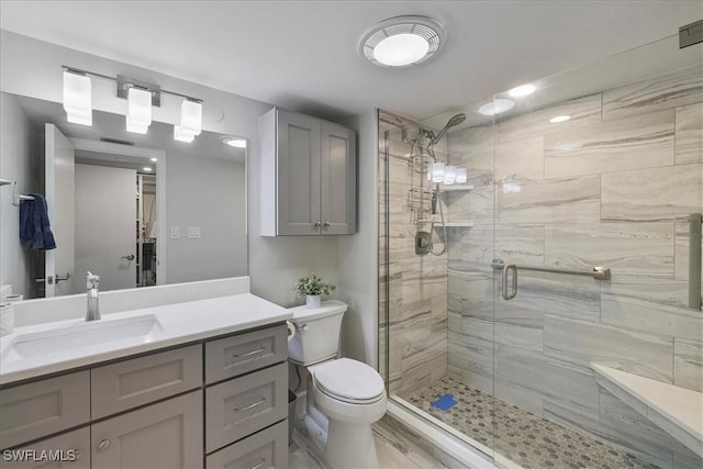 7148 Estero Blvd Unit 423, Fort Myers Beach, FL 33931 - bathroom featuring toilet, a stall shower, and vanity