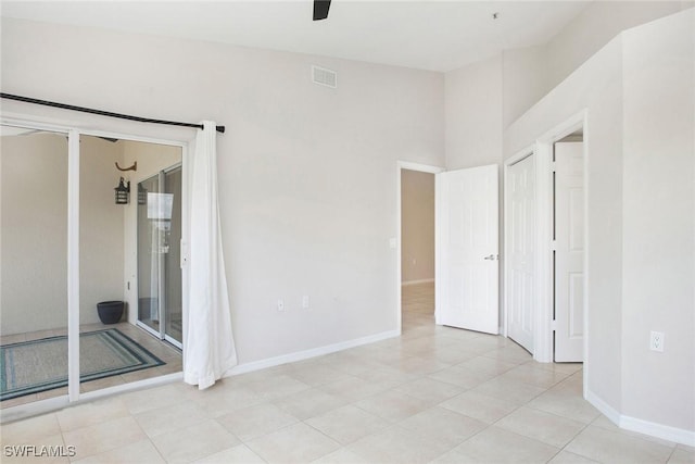 4940 Cougar Ct S Unit 201, Naples, FL 34109 - empty room featuring baseboards, a ceiling fan, visible vents, and light tile patterned floors