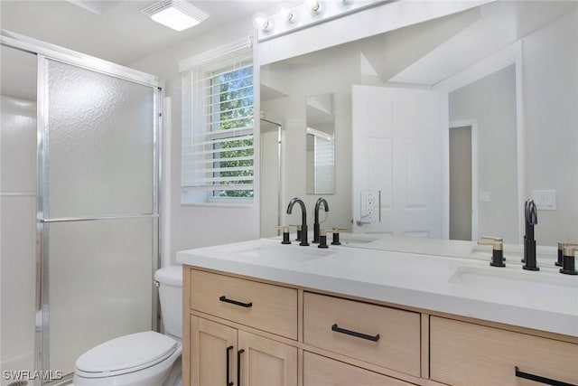 4940 Cougar Ct S Unit 201, Naples, FL 34109 - bathroom featuring a shower stall, toilet, and a sink