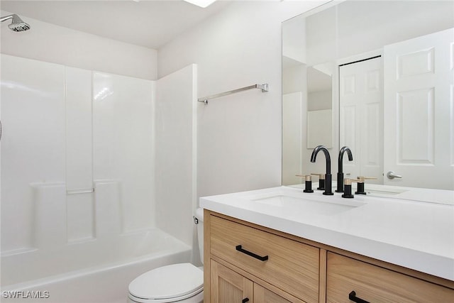 4940 Cougar Ct S Unit 201, Naples, FL 34109 - bathroom with toilet, vanity, and bathing tub / shower combination