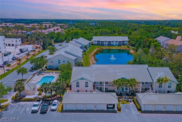 4940 Cougar Ct S Unit 201, Naples, FL 34109 - aerial view at dusk with a water view