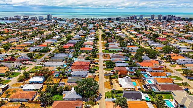 bird's eye view with a residential view and a water view