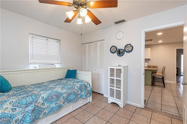 bedroom with visible vents, a closet, light tile patterned floors, ceiling fan, and recessed lighting