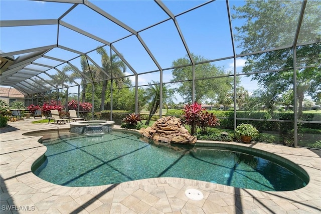 12581 Vittoria Way, Fort Myers, FL 33912 - view of pool featuring a patio area, a pool with connected hot tub, and a lanai