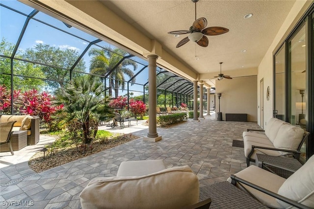 12581 Vittoria Way, Fort Myers, FL 33912 - view of patio / terrace featuring a ceiling fan, an outdoor hangout area, and glass enclosure
