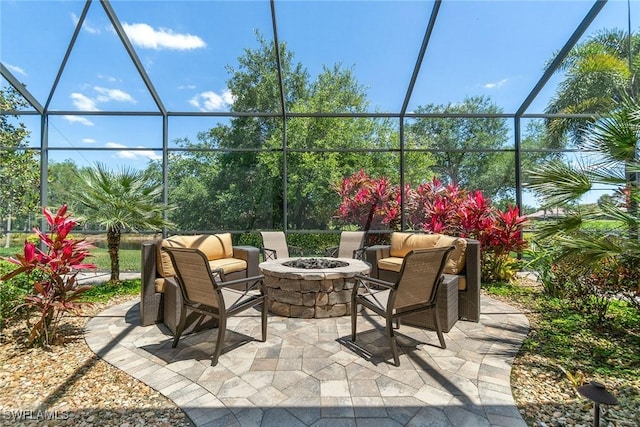 12581 Vittoria Way, Fort Myers, FL 33912 - view of patio / terrace with a lanai and an outdoor fire pit