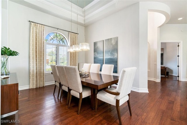 12581 Vittoria Way, Fort Myers, FL 33912 - dining area with hardwood / wood-style floors, baseboards, a chandelier, ornamental molding, and a towering ceiling