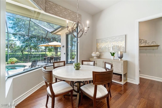 12581 Vittoria Way, Fort Myers, FL 33912 - dining area featuring wood finished floors, a chandelier, and baseboards