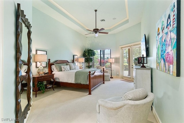 12581 Vittoria Way, Fort Myers, FL 33912 - bedroom featuring light colored carpet, access to exterior, a tray ceiling, baseboards, and a high ceiling