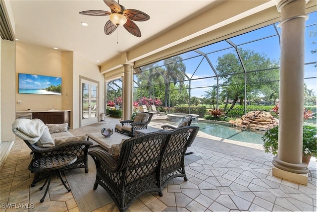 12581 Vittoria Way, Fort Myers, FL 33912 - view of patio featuring french doors, outdoor lounge area, glass enclosure, a ceiling fan, and a pool with connected hot tub