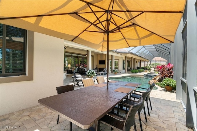 12581 Vittoria Way, Fort Myers, FL 33912 - view of patio / terrace featuring a pool with connected hot tub and outdoor dining space