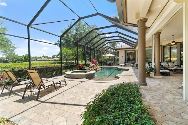 12581 Vittoria Way, Fort Myers, FL 33912 - view of pool featuring a patio area, a ceiling fan, a pool with connected hot tub, and a lanai