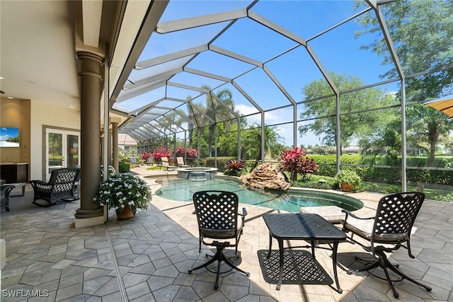 12581 Vittoria Way, Fort Myers, FL 33912 - view of patio / terrace featuring a pool with connected hot tub and glass enclosure