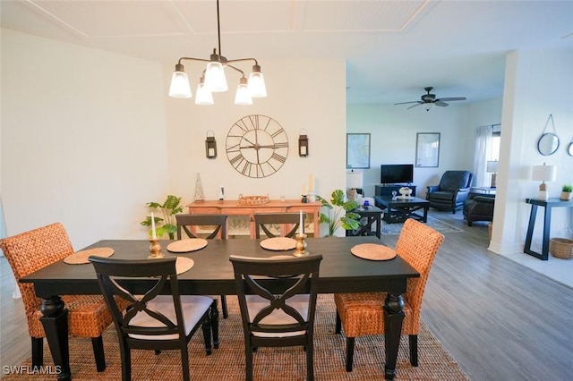 2533 SW 17th Pl, Cape Coral, FL 33914 - dining room featuring ceiling fan with notable chandelier and wood finished floors