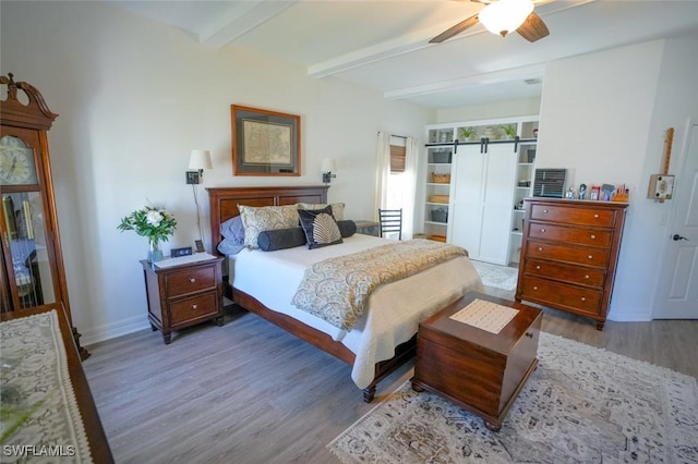 2533 SW 17th Pl, Cape Coral, FL 33914 - bedroom featuring baseboards, beamed ceiling, ceiling fan, and wood finished floors