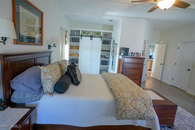 2533 SW 17th Pl, Cape Coral, FL 33914 - bedroom with a closet, wood finished floors, and a ceiling fan