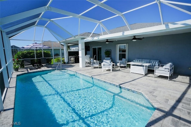 2533 SW 17th Pl, Cape Coral, FL 33914 - outdoor pool featuring outdoor lounge area, ceiling fan, a patio, and glass enclosure