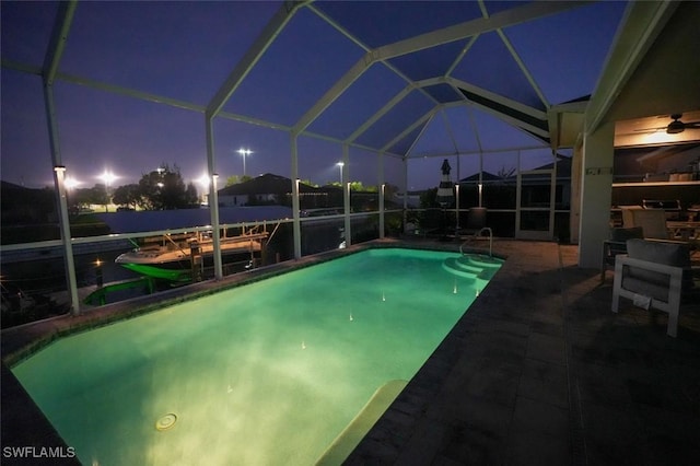 2533 SW 17th Pl, Cape Coral, FL 33914 - pool at twilight with a patio, an outdoor pool, and glass enclosure