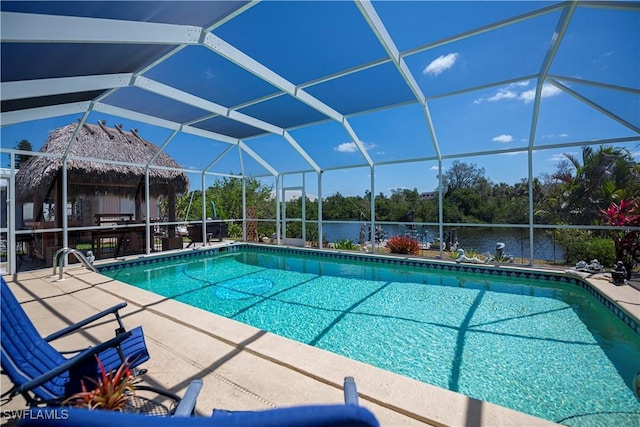 4238 Gardner Dr, Port Charlotte, FL 33952 - outdoor pool with glass enclosure, a water view, and a patio area