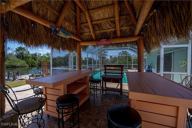4238 Gardner Dr, Port Charlotte, FL 33952 - exterior space featuring a water view, a gazebo, a lanai, and outdoor dry bar