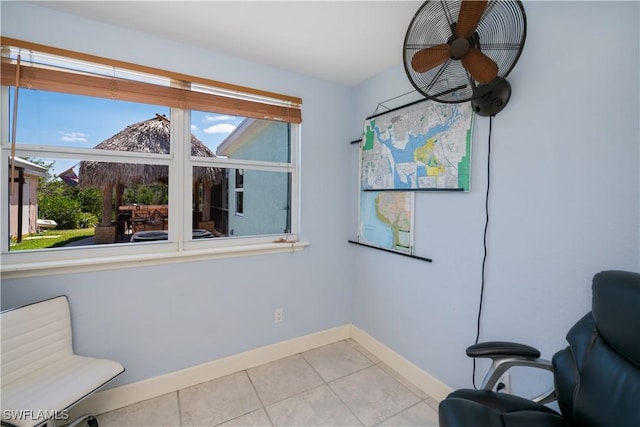 4238 Gardner Dr, Port Charlotte, FL 33952 - living area with tile patterned flooring, baseboards, ceiling fan, and a wealth of natural light