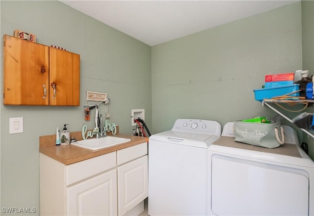 4238 Gardner Dr, Port Charlotte, FL 33952 - clothes washing area with a sink, cabinet space, and washing machine and clothes dryer