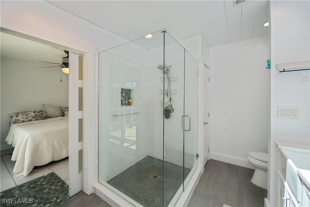 4238 Gardner Dr, Port Charlotte, FL 33952 - ensuite bathroom featuring tile patterned flooring, toilet, a stall shower, a ceiling fan, and ensuite bath