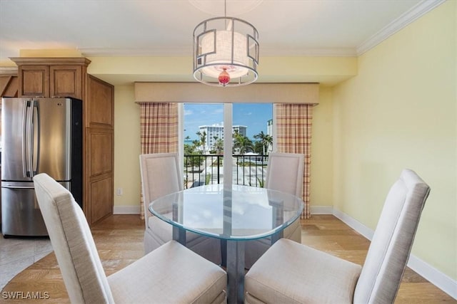 2900 Gulf Shore Blvd N Unit 406, Naples, FL 34103 - dining room featuring baseboards, ornamental molding, and light wood-style floors