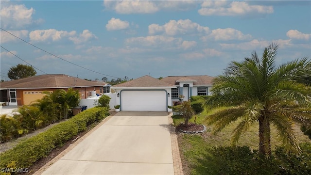view of front facade featuring fence, stucco siding, an attached garage, and concrete driveway