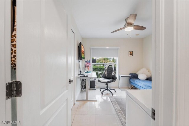 bedroom with light tile patterned floors and ceiling fan