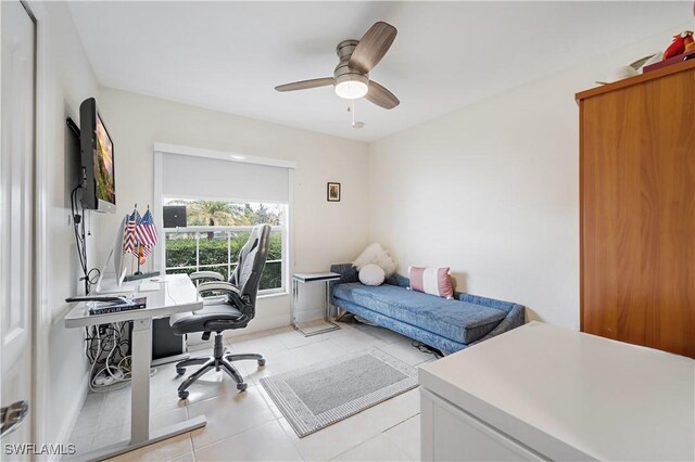 bedroom with light tile patterned floors and ceiling fan