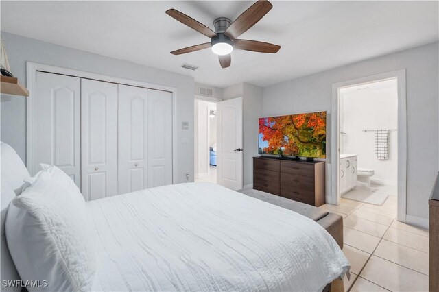 bedroom featuring visible vents, a closet, ceiling fan, and light tile patterned floors