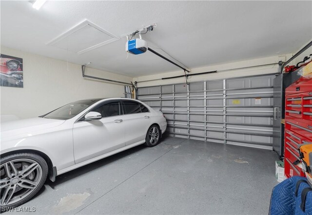 garage featuring a garage door opener