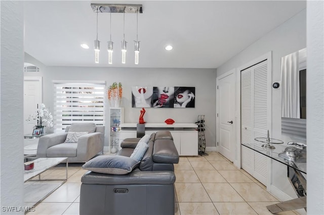 living room with light tile patterned floors, visible vents, and recessed lighting