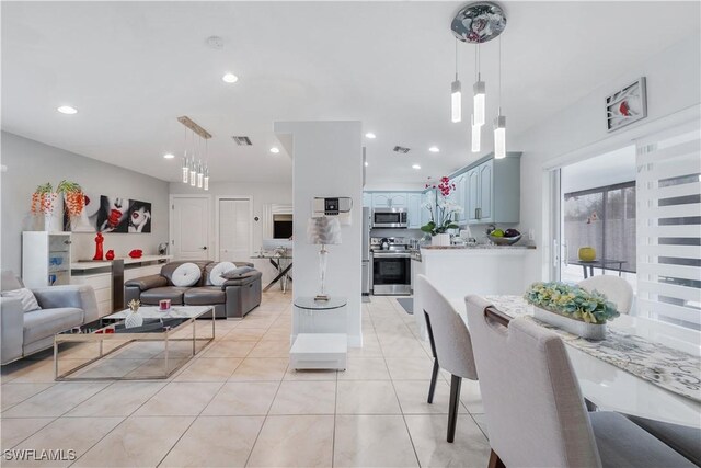dining room featuring light tile patterned flooring, visible vents, and recessed lighting