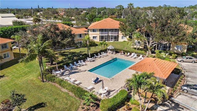 1758 Reuven Cir Unit 1503, Naples, FL 34112 - community pool with a yard, a patio, and a residential view
