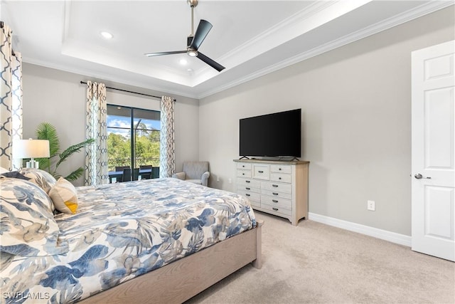 bedroom featuring access to outside, a tray ceiling, light colored carpet, ornamental molding, and baseboards