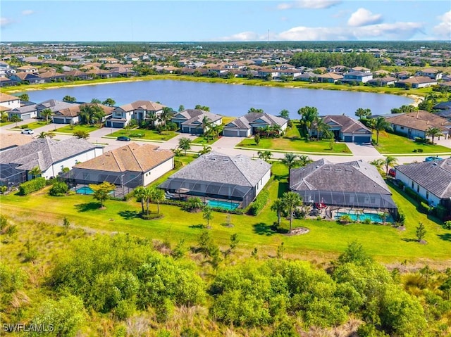 bird's eye view featuring a water view and a residential view