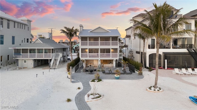 26628 Hickory Blvd, Bonita Springs, FL 34134 - property at dusk featuring stairway