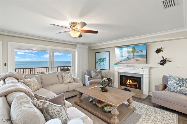 26628 Hickory Blvd, Bonita Springs, FL 34134 - living room with ceiling fan, a premium fireplace, ornamental molding, and wood finished floors