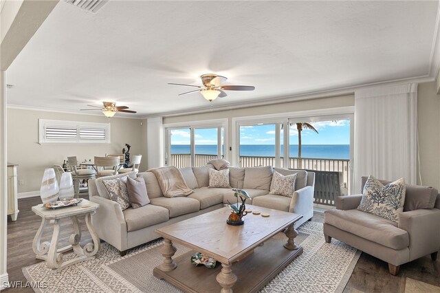 26628 Hickory Blvd, Bonita Springs, FL 34134 - living room featuring ceiling fan, wood finished floors, crown molding, and a water view