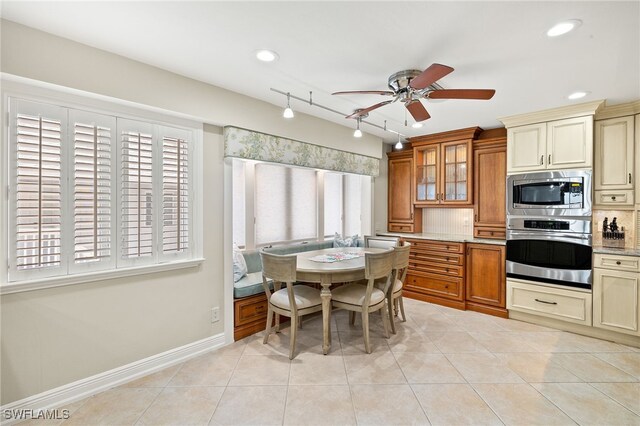 26628 Hickory Blvd, Bonita Springs, FL 34134 - kitchen with appliances with stainless steel finishes, a ceiling fan, brown cabinets, glass insert cabinets, and recessed lighting
