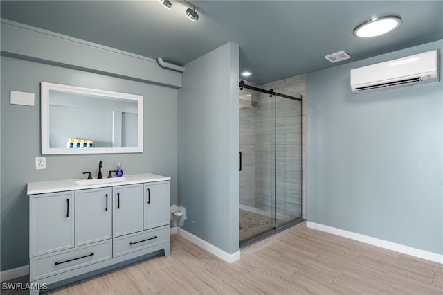 26628 Hickory Blvd, Bonita Springs, FL 34134 - full bath with an AC wall unit, vanity, a shower stall, and wood finished floors