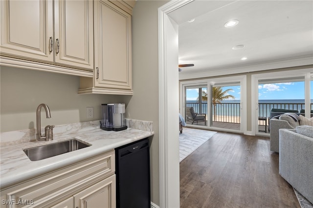 26628 Hickory Blvd, Bonita Springs, FL 34134 - kitchen featuring black dishwasher, cream cabinetry, open floor plan, wood finished floors, and light stone counters